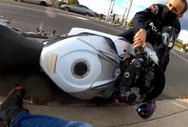 Canadian policeman pulls rider off motorbike 48 Police hit Biker